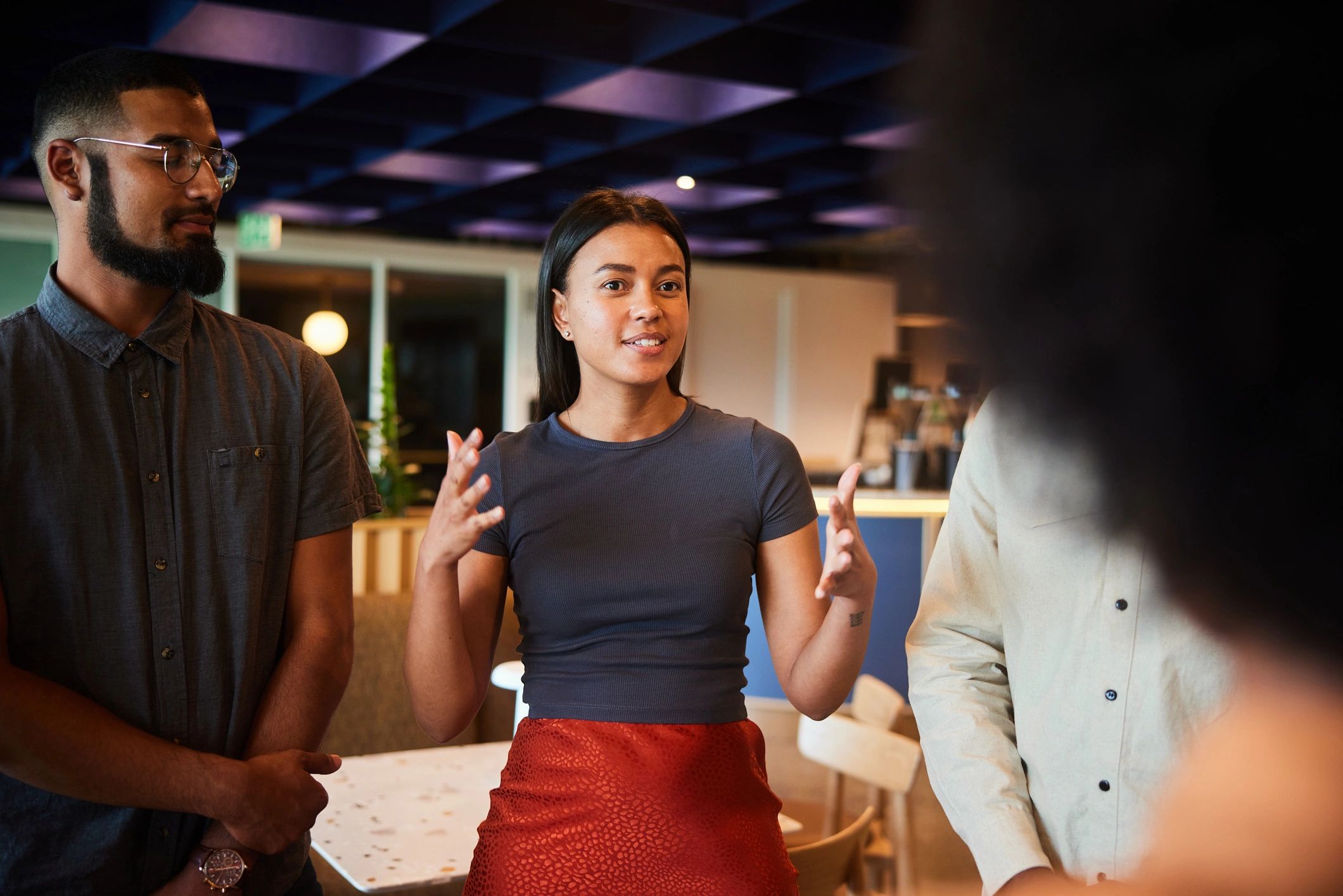 Professionals discussing startup innovation in a modern office
