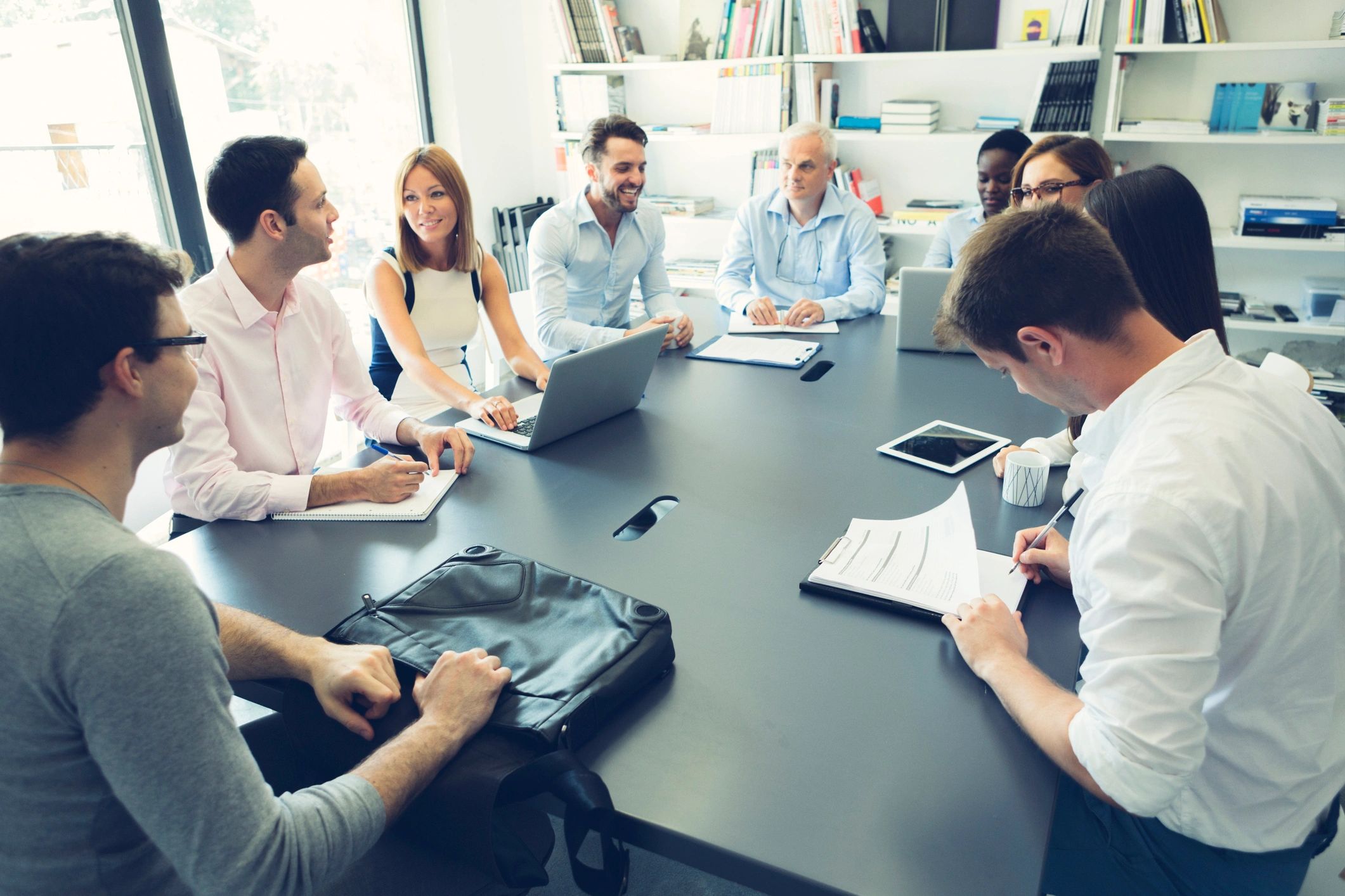 Editorial meeting in a professional newsroom setting
